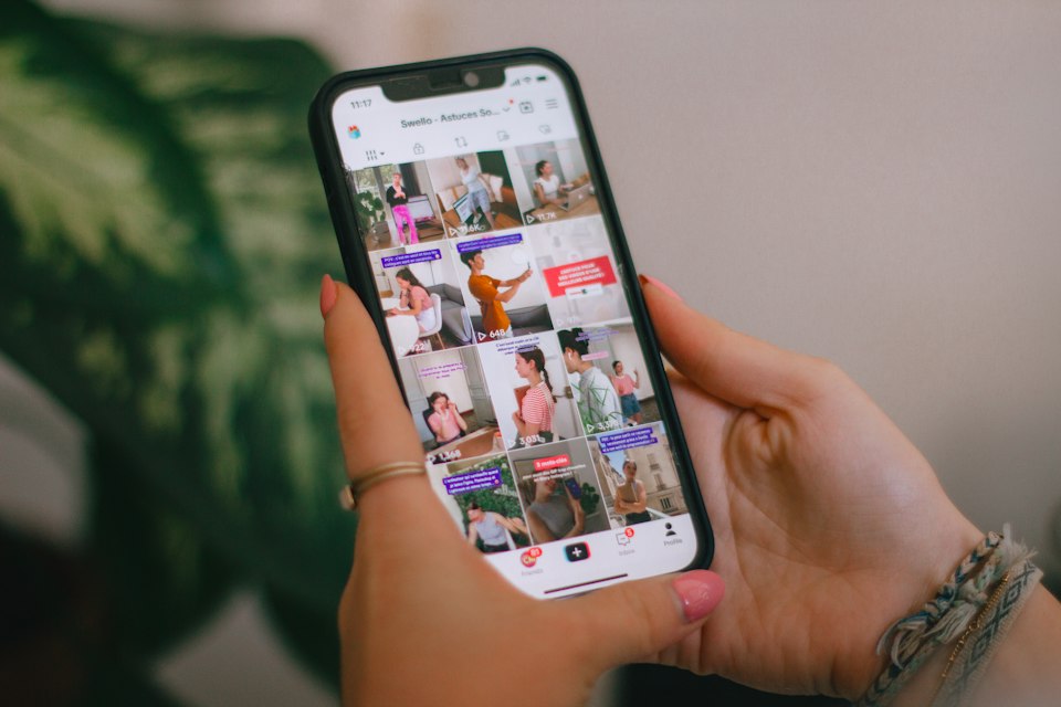 Person browsing video content on a smartphone