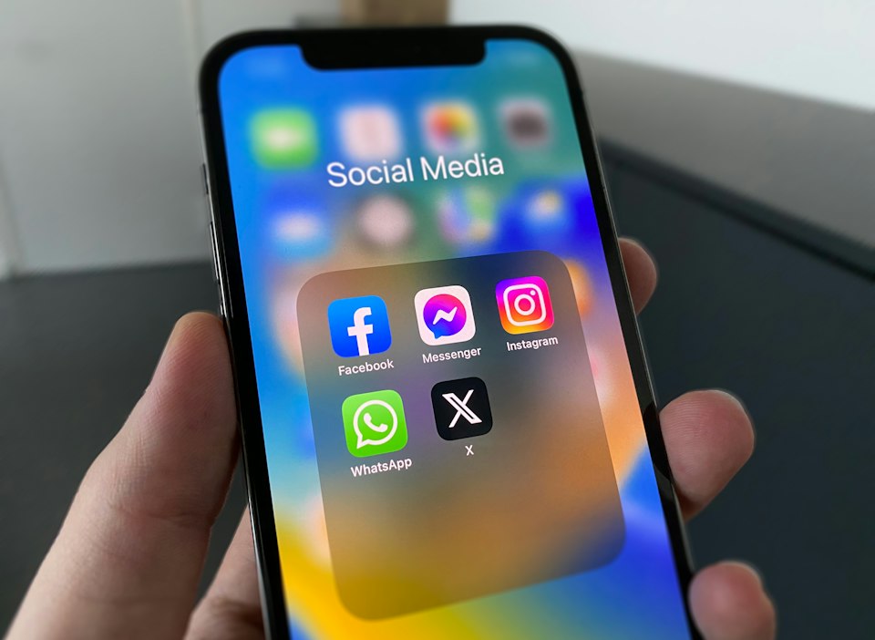 Smartphone showing social media apps while checking a public profile