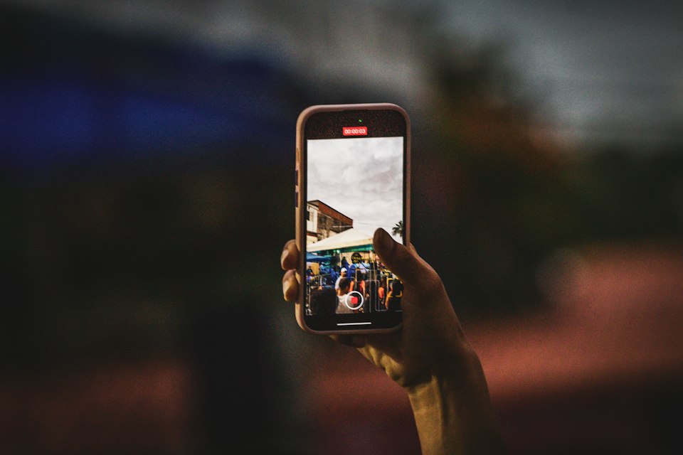 Person taking a photograph with a smartphone